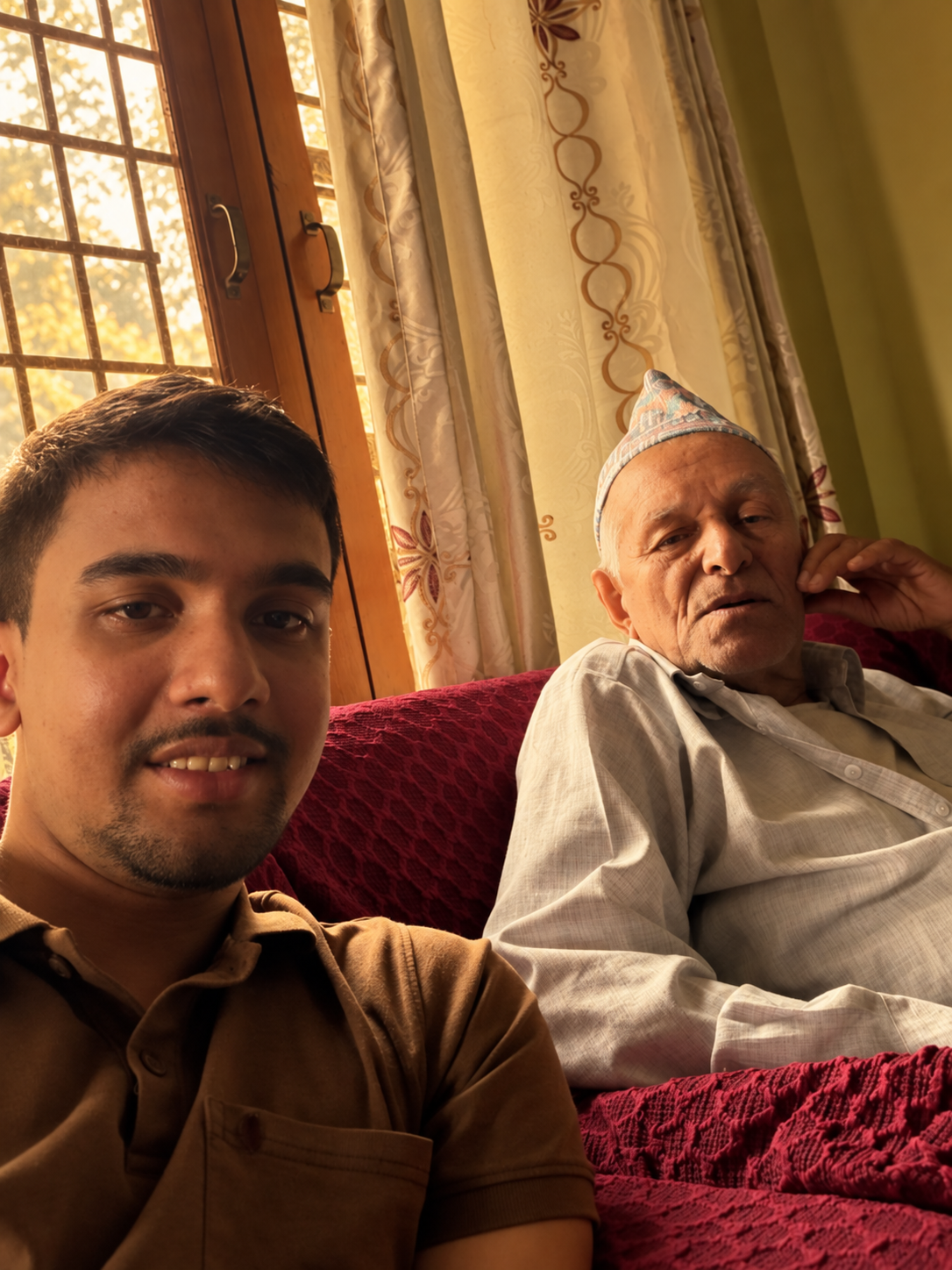 Me sitting beside my grandfather
